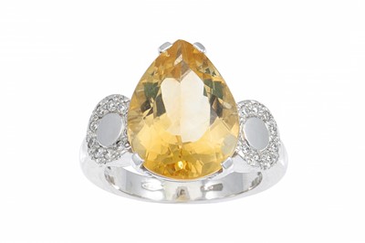 Lot 260 - A CITRINE AND DIAMOND RING, the pear shaped...