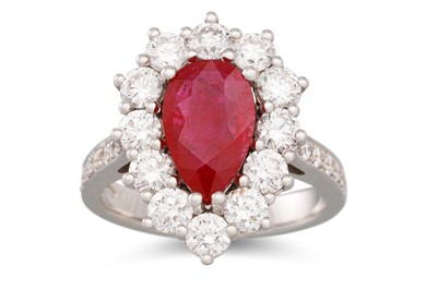 Lot 209 - A DIAMOND AND RUBY CLUSTER RING, the pear...