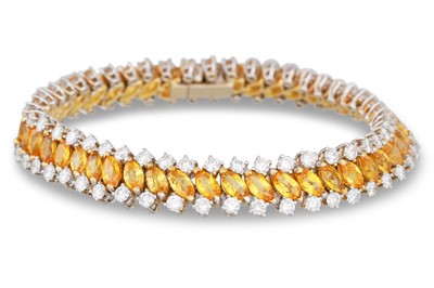 Lot 300 - A YELLOW SAPPHIRE AND DIAMOND BRACELET, the...