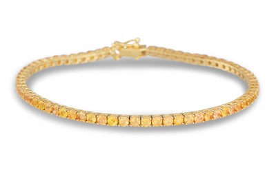 Lot 301 - A YELLOW SAPPHIRE LINE BRACELET, the circular...