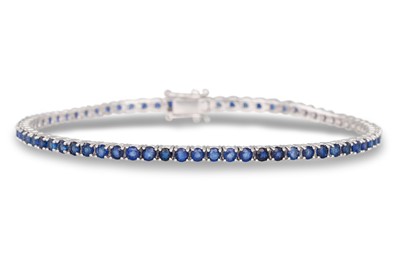 Lot 303 - A SAPPHIRE LINE BRACELET, the circular...