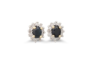 Lot 22 - A PAIR OF DIAMOND AND SAPPHIRE CLUSTER...