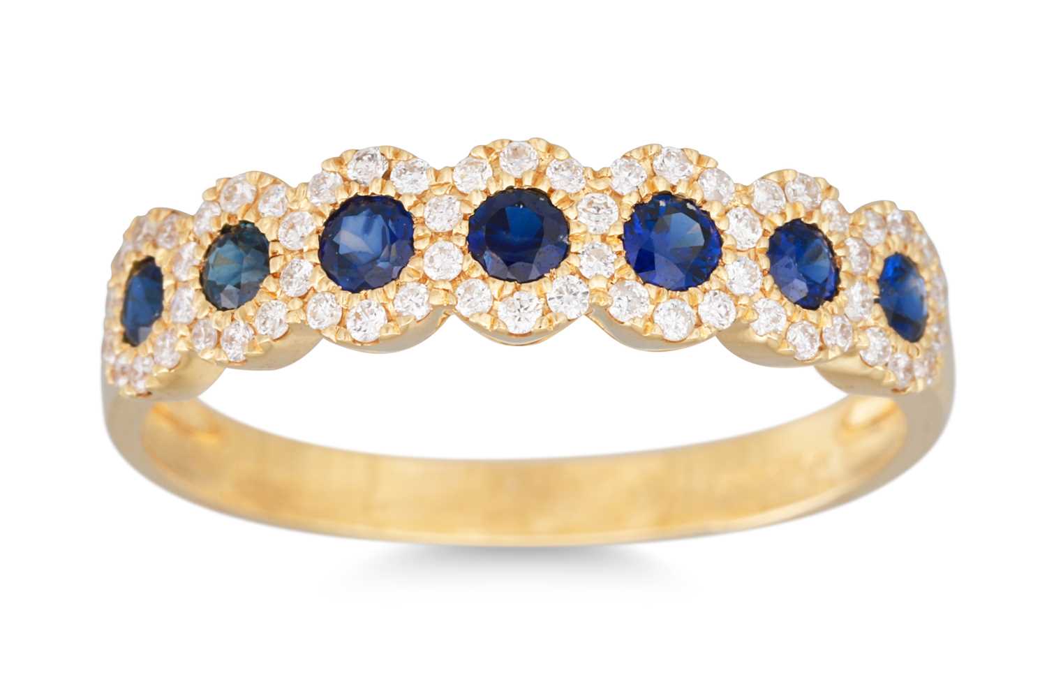 Lot 45 - A DIAMOND AND SAPPHIRE SEVEN STONE RING, the...