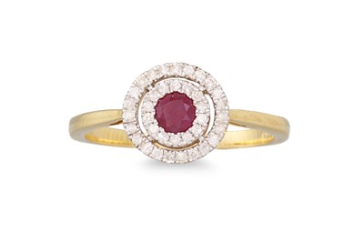Lot 46 - A DIAMOND AND RUBY CLUSTER RING, the circular...