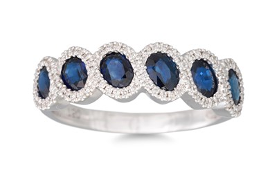 Lot 83 - A DIAMOND AND SAPPHIRE CLUSTER RING, mounted...