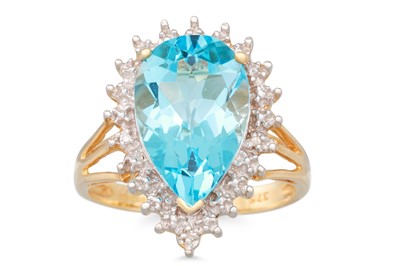 Lot 92 - A TOPAZ RING, the pear shaped blue topaz to...