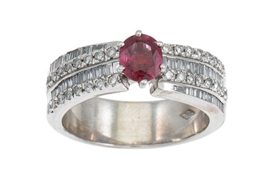 Lot 276 - A RUBY AND DIAMOND RING, the oval ruby to...