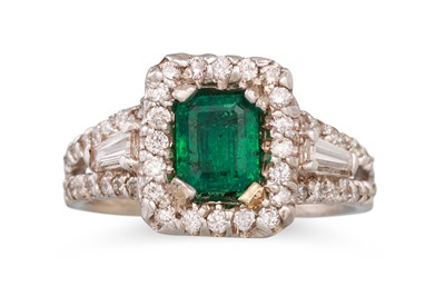 Lot 203 - A DIAMOND AND EMERALD CLUSTER RING, mounted...