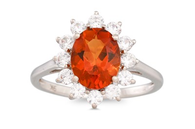 Lot 113 - A CITRINE AND ZIRCON RING, mounted in 9ct...