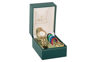 Lot 427 - A LADY'S GUCCI WRISTWATCH, with spare bezels &...