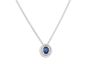 Lot 260 - A DIAMOND AND SAPPHIRE CLUSTER PENDANT, the...