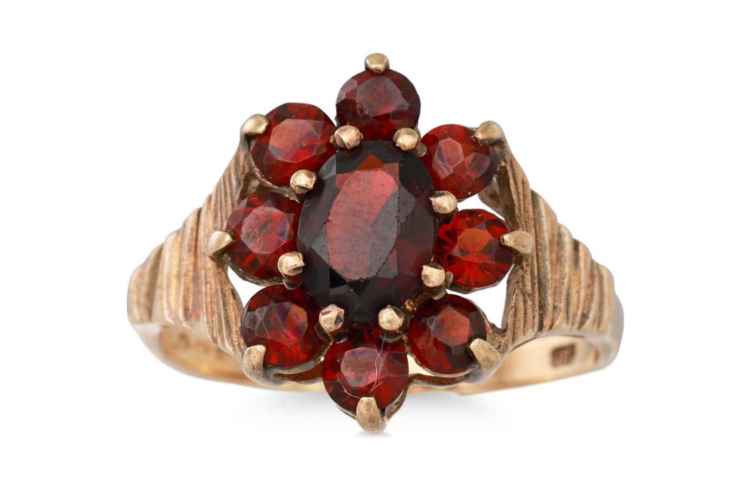 Lot 94 - A VINTAGE GARNET DRESS RING, mounted in 9ct...