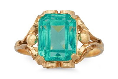 Lot 95 - A DRESS RING, the green glass stone mounted in...