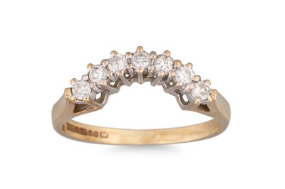 Lot 13 - A DIAMOND SET SHAPED BAND, mounted in 9ct gold....