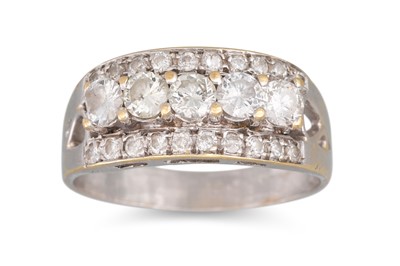 Lot 99 - A DIAMOND TRIPLE ROW DRESS RING, mounted in...