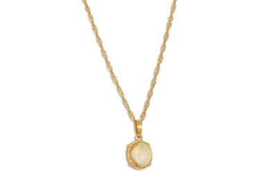 Lot 266 - A CITRINE PENDANT, mounted in 22ct gold, on a...