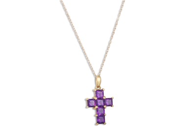 Lot 21 - AN AMETHYST CROSS, mounted in 9ct gold on a...