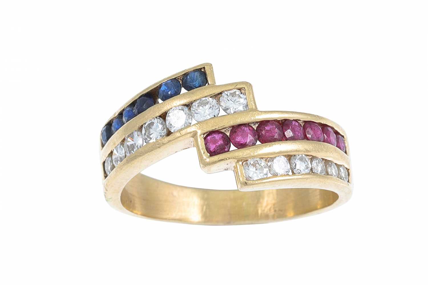 Lot 41 - A DIAMOND SAPPHIRE AND RUBY RING, of cross...