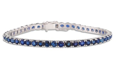 Lot 335 - A SAPPHIRE LINE BRACELET, circular stones,...