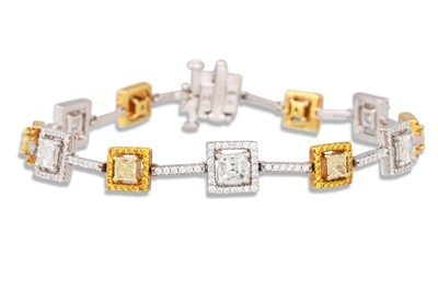 Lot 337 - A DIAMOND LINE BRACELET, of square cluster...