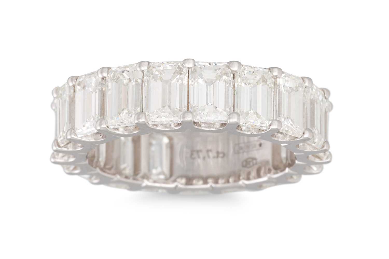 Lot 339 - A DIAMOND ETERNITY RING, the emerald cut...