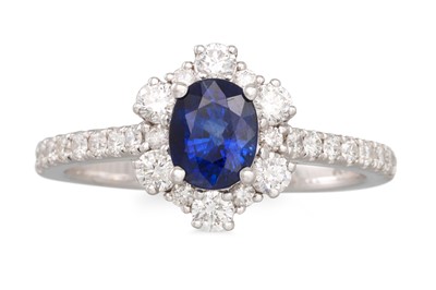 Lot 340 - A SAPPHIRE AND DIAMOND CLUSTER RING, oval...