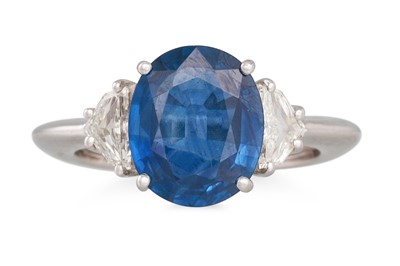 Lot 343 - A SAPPHIRE AND DIAMOND RING, the oval sapphire...