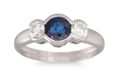 Lot 381 - A SAPPHIRE AND DIAMOND THREE STONE RING, the...