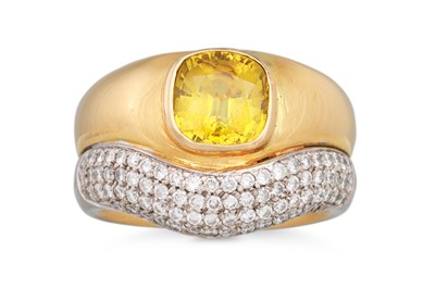 Lot 244 - A YELLOW SAPPHIRE AND DIAMOND RING, the...