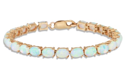 Lot 272 - AN OPAL LINE BRACELET, the oval opals mounted...