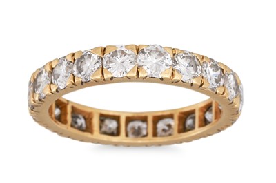 Lot 395 - A DIAMOND ETERNITY RING, the brilliant cut...