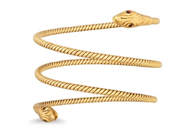 Lot 401 - A VINTAGE 18CT GOLD SNAKE BANGLE, coiled form,...