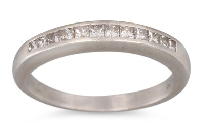 Lot 15 - A DIAMOND HALF ETERNITY RING, channel set with...