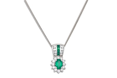 Lot 317 - AN EMERALD AND DIAMOND CLUSTER PENDANT,...