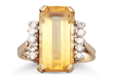 Lot 150 - A CITRINE AND DIAMOND DRESS RING, mounted in...