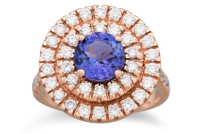 Lot 185 - A TANZANITE AND DIAMOND CLUSTER RING, the...