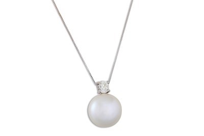 Lot 213 - A DIAMOND AND BUTTON PEARL PENDANT, on a chain....