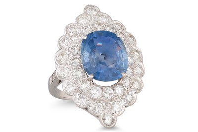 Lot 244 - A SAPPHIRE AND DIAMOND CLUSTER RING, the oval...