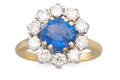 Lot 246 - A SAPPHIRE AND DIAMOND CLUSTER RING, the oval...