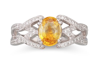 Lot 255 - A YELLOW SAPPHIRE AND DIAMOND RING, the oval...