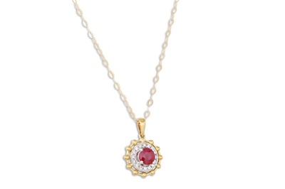 Lot 27 - A DIAMOND AND RUBY PENDANT, the circular ruby...