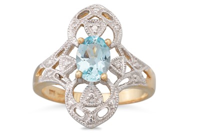 Lot 65 - A TOPAZ RING, the oval topaz to an openwork...