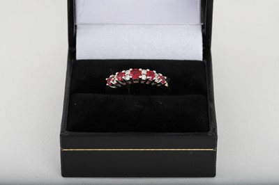 Lot 208 - A RUBY AND DIAMOND RING, mounted in 9ct yellow...