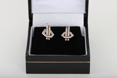 Lot 209 - A PAIR OF DIAMOND EARRINGS, of shaped form,...