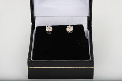 Lot 210 - A PAIR OF DIAMOND CLUSTER EARRINGS, mounted in...