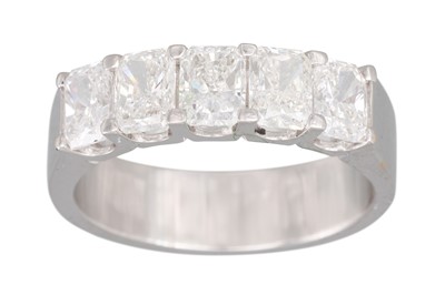 Lot 214 - A FIVE STONE RADIANT CUT DIAMOND RING, mounted...