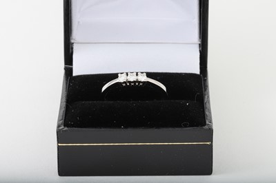 Lot 86 - A THREE STONE DIAMOND RING, mounted in 18ct...
