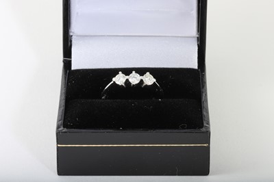 Lot 89 - A THREE STONE DIAMOND RING, mounted in 18ct...