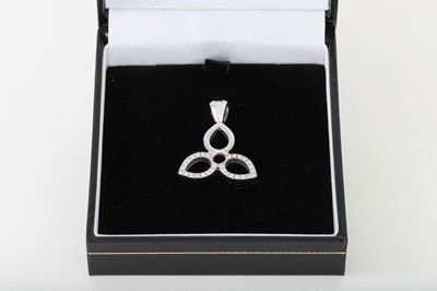Lot 92 - A DIAMOND PENDANT, shaped form, mounted in...