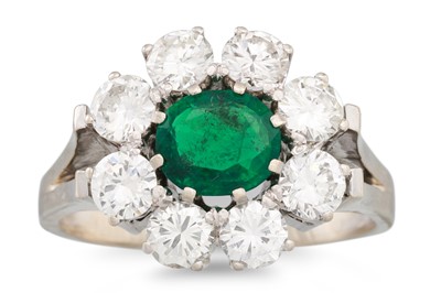 Lot 189 - AN EMERALD AND DIAMOND RING, the oval emerald...